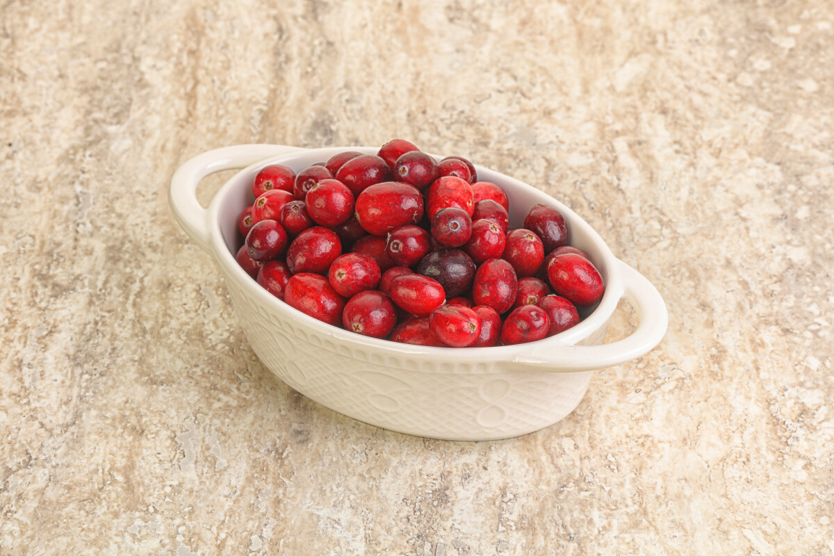 Ripe sweet tasty cranberry in the bowl