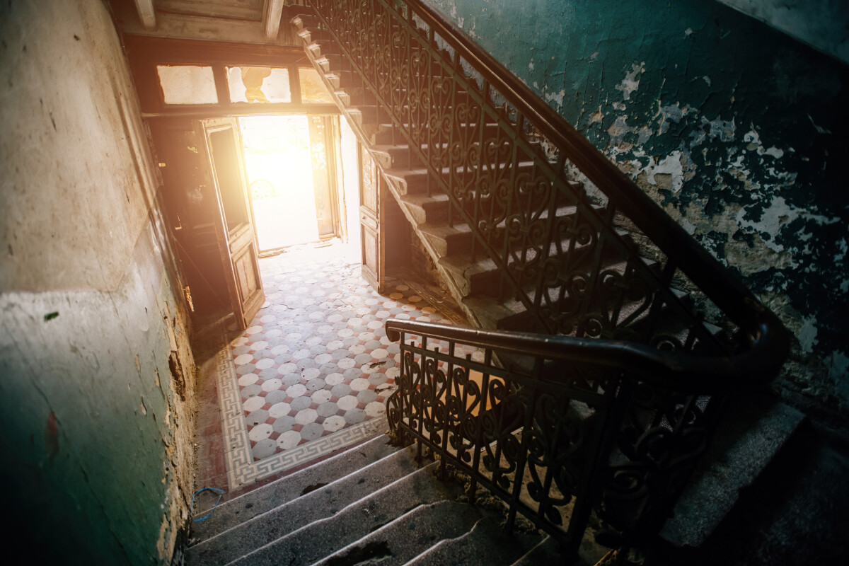 Old vintage staircase at the old abandoned building