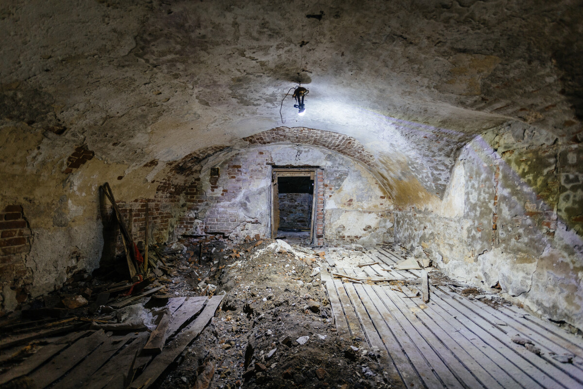 Abandoned empty old dark underground vaulted cellar