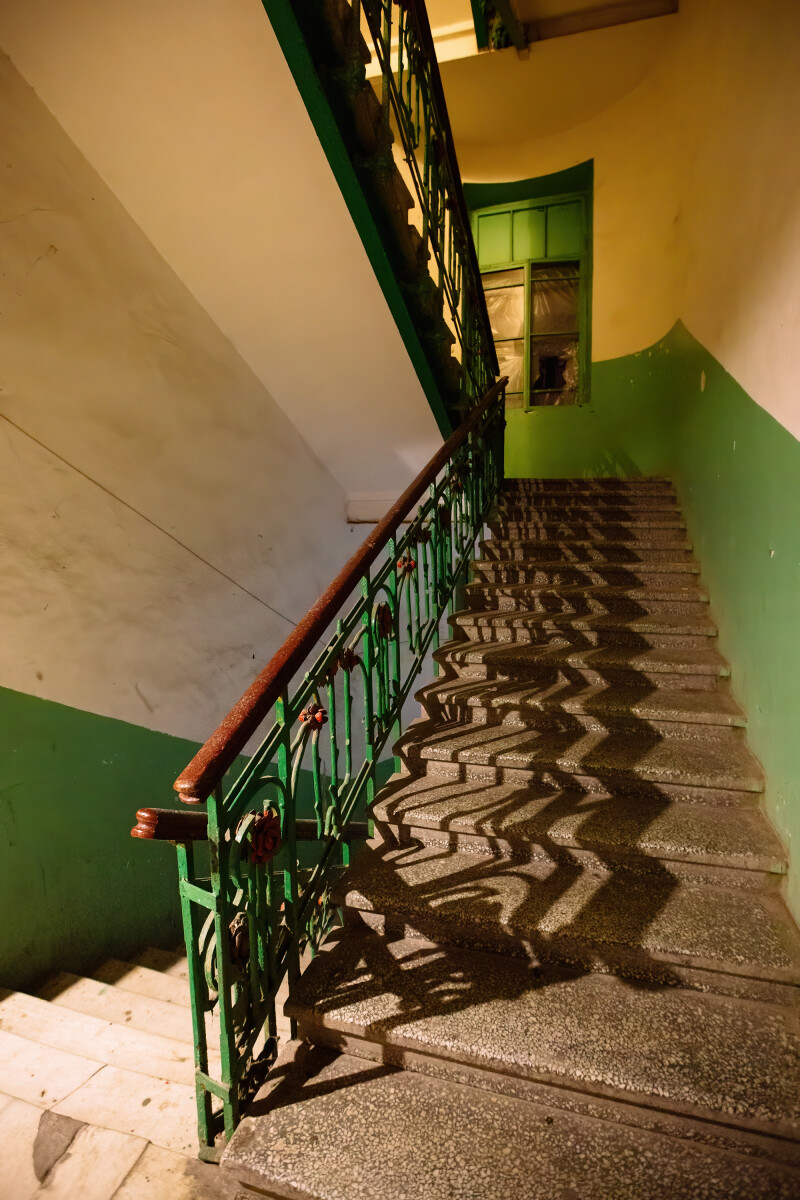 Old vintage staircase at the old abandoned building