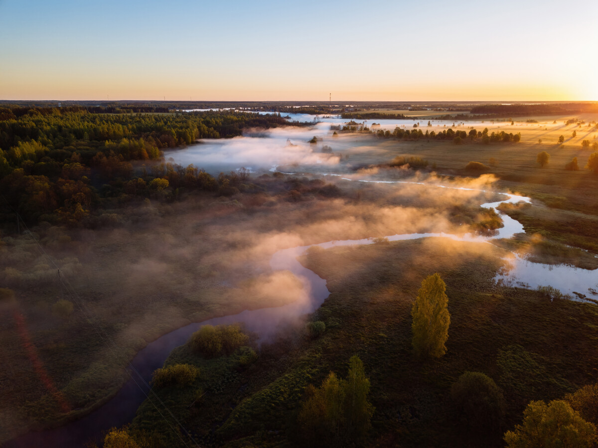 Sunrise and morning mist at countryside, aerial view