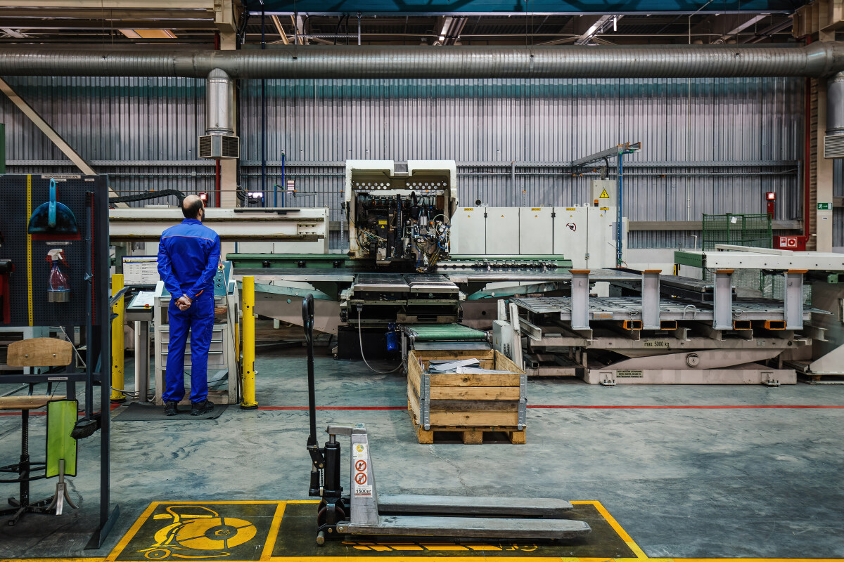 Engineer operates CNC perforation machine