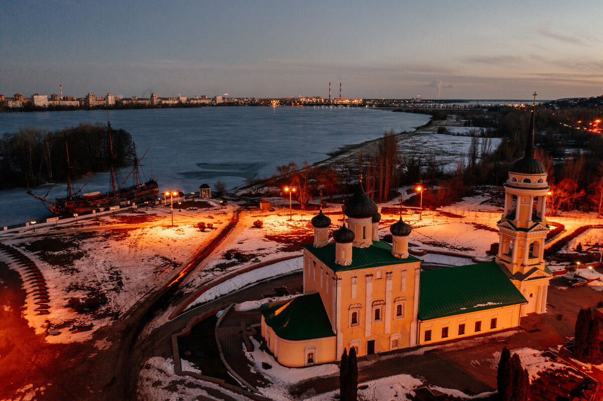 Night city of Voronezh, aerial view. Assumption Admiralty Church and monument of first Russian ship