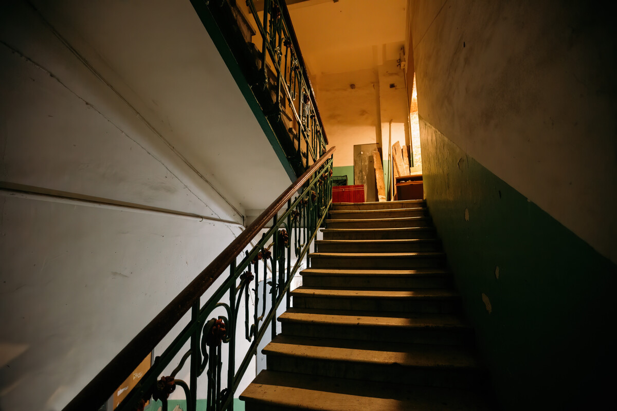 Old vintage staircase at the old abandoned building