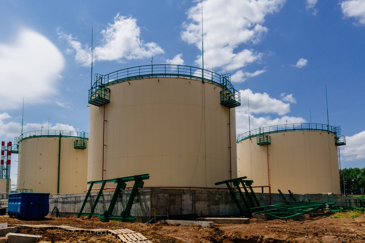 Large industrial round tanks for chemical production or oil. Construction of chemical factory