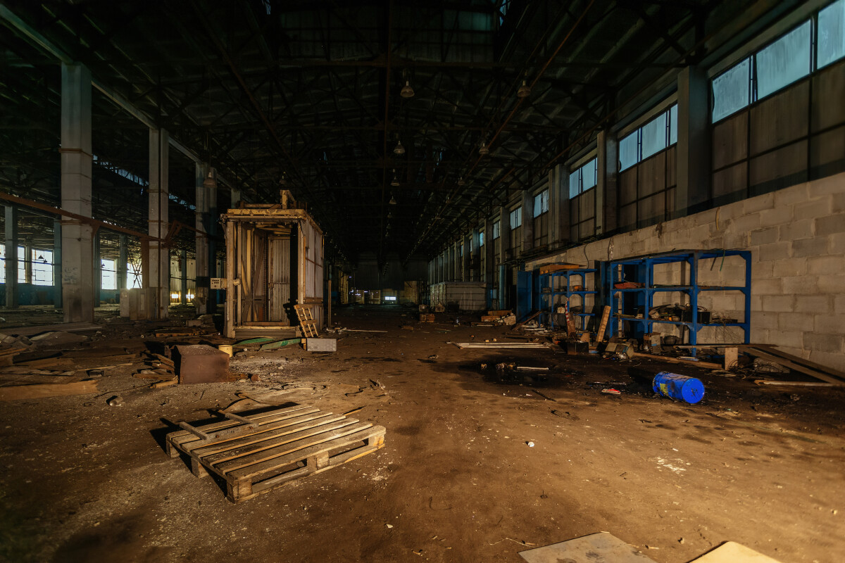 Old broken empty abandoned industrial building interior