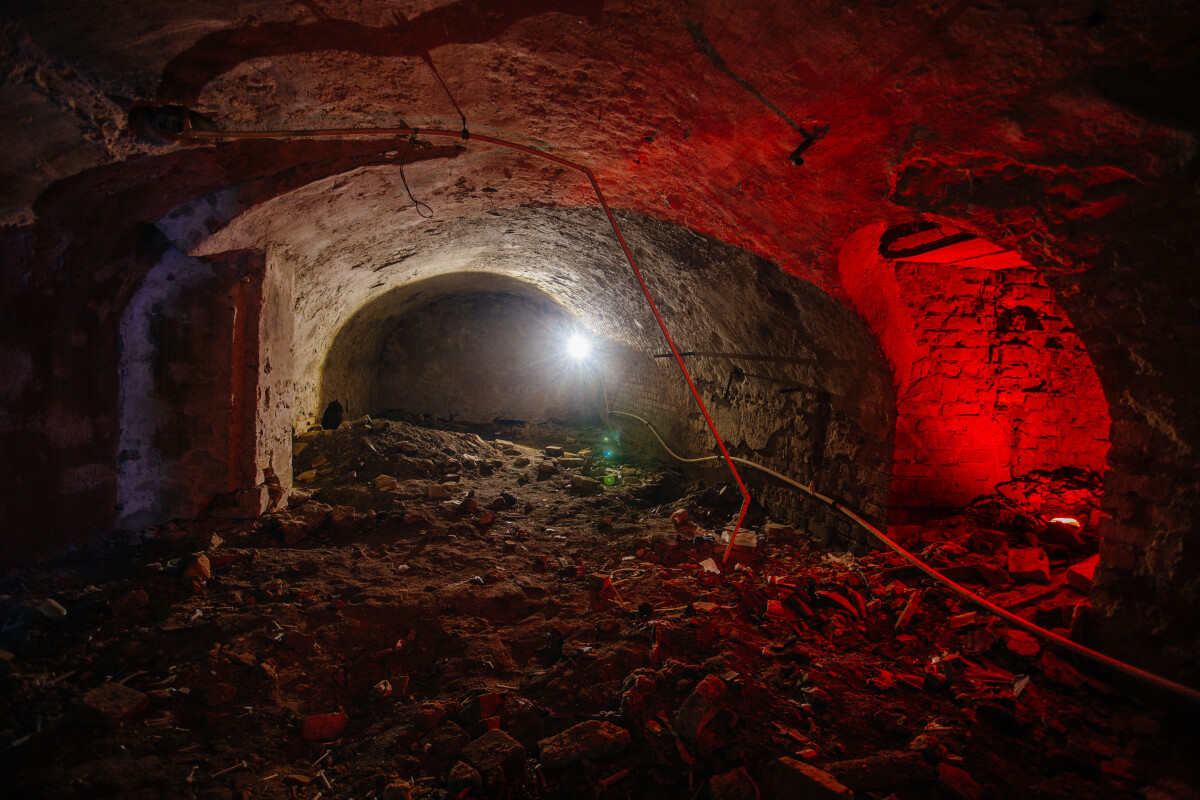 Abandoned empty old dark underground vaulted cellar