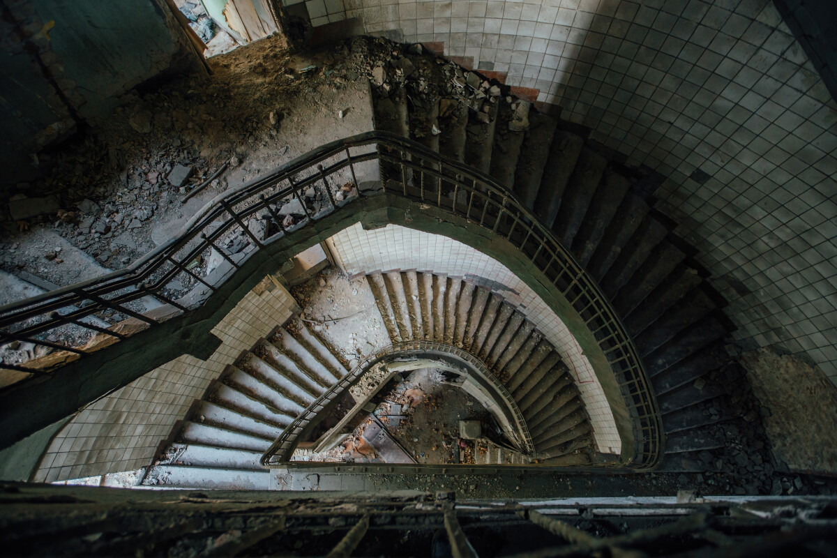 Old spiral staircase at the old abandoned building, top view