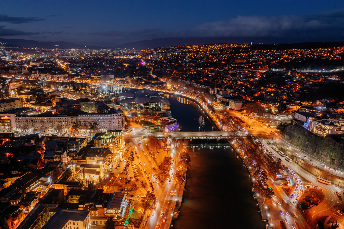 Panoramic night aerial view of Tbilisi, capital of Georgia from drone