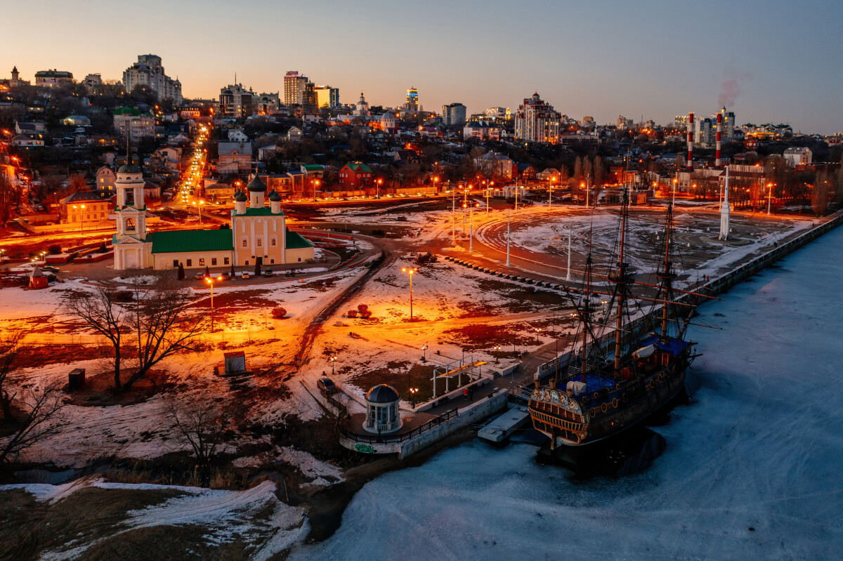 Night city of Voronezh, aerial view. Monument of first Russian ship and Assumption Admiralty Church