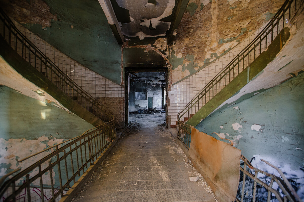 Old spiral staircase at the old burnt abandoned building