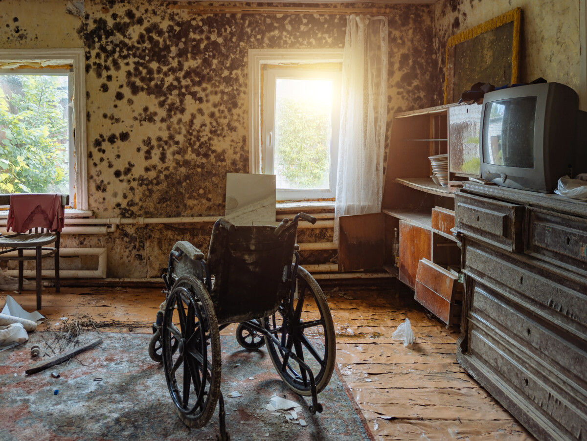 Empty wheelchair in old abandoned house