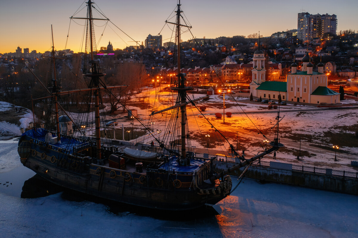 Night city of Voronezh, aerial view. Monument of first Russian ship and Assumption Admiralty Church