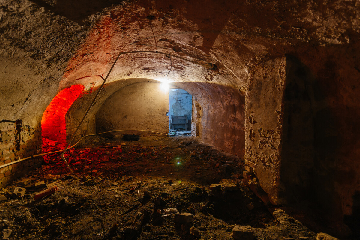 Abandoned empty old dark underground vaulted cellar