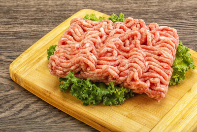 Raw pork minced meat over board for cooking