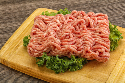 Raw pork minced meat over board for cooking